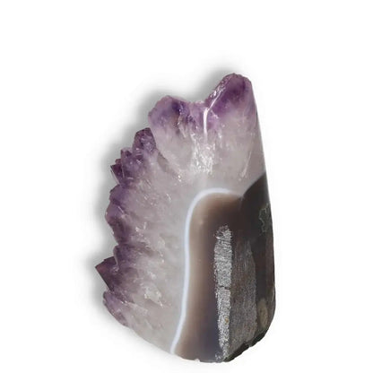 Amethyst cut base geode showcasing vibrant violet hue by Sylvia Crystals, ideal for stress relief and focus enhancement.