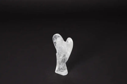 Angel Lemurian Quartz figurine on dark background, known for amethyst properties reducing stress, boosting energy, and enhancing concentration.