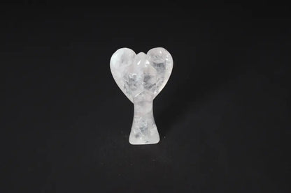 Rose Quartz angel figurine, 9 cm, known for promoting love, empathy, and emotional healing, on a dark background.