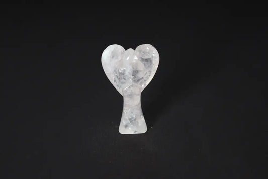 Rose Quartz angel figurine, 9 cm, known for promoting love, empathy, and emotional healing, on a dark background.