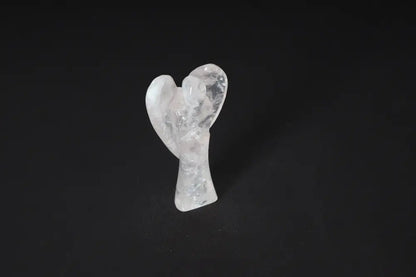 Angel-shaped rose quartz stone sculpture on a dark background, symbolizing love and emotional healing. 9 cm tall.