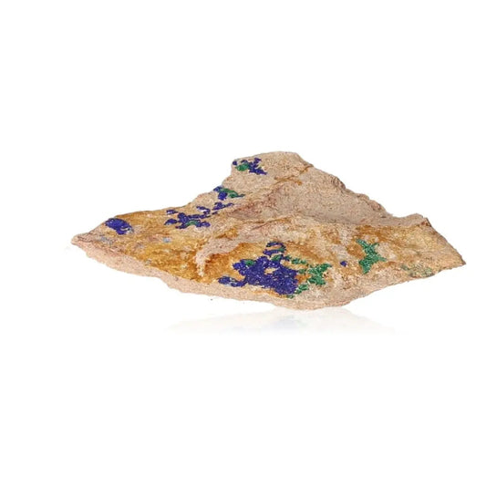 Azurite mineral with deep blue patterns, copper-rich composition, ideal for mental clarity and spiritual growth, showcased on white background.