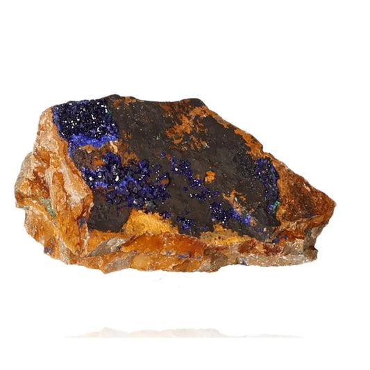 Azurite mineral showcasing deep blue hues on rocky surface, ideal for collectors and enhancing focus and self-awareness.
