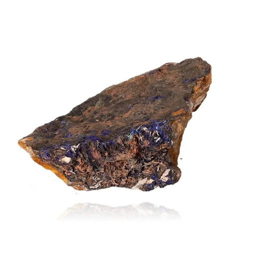 Raw Azurite mineral with deep blue hues and unique patterns, ideal for mental clarity and personal growth, on a white background.