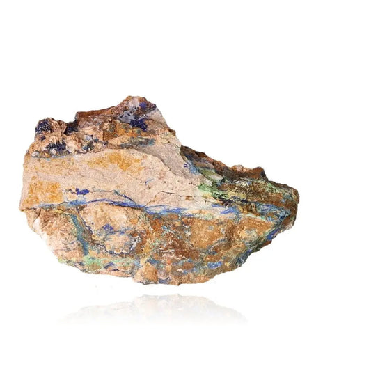 Azurite mineral rock with deep blue and green patterns, known for mental clarity and spiritual growth, isolated on white background.
