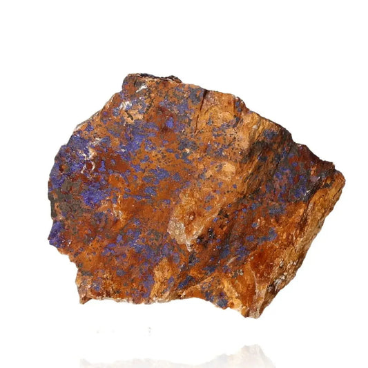 Azurite mineral specimen displaying deep blue hues and unique patterns, known for enhancing mental clarity and spiritual growth.