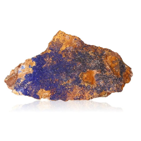 Raw Azurite mineral with deep blue hues on a white background, ideal for collectors and spiritual seekers.