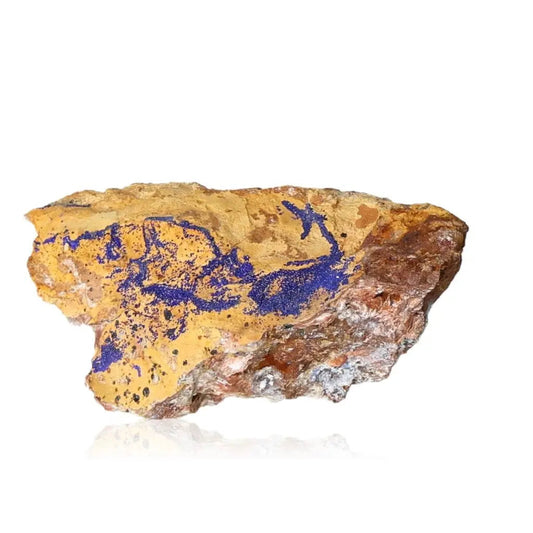 Azurite druzy stone with vibrant deep blue mineral formations for enhanced intuition and spiritual insight on a natural brown rock surface.
