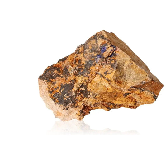 Azurite druzy with deep blue tones on a rocky surface, known for enhancing intuition and spiritual insight.
