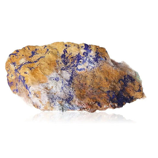 Azurite druze mineral with deep blue patterns, known for enhancing intuition and spiritual insights, set against a neutral background.