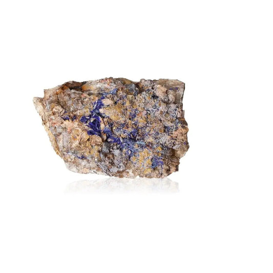 Azurite druzy stone with deep blue hues, known for enhancing intuition and spiritual insight, on a reflective surface.