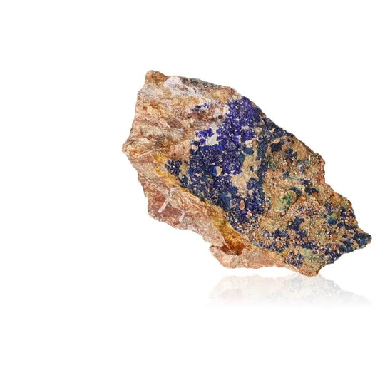 Azurite druze with vibrant blue crystals enhancing intuition and spiritual insight against a white background.