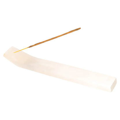 Incense stick burning on a sleek white holder, ideal for Bali Harmony Incense Blend, promoting balance and serenity in your space.
