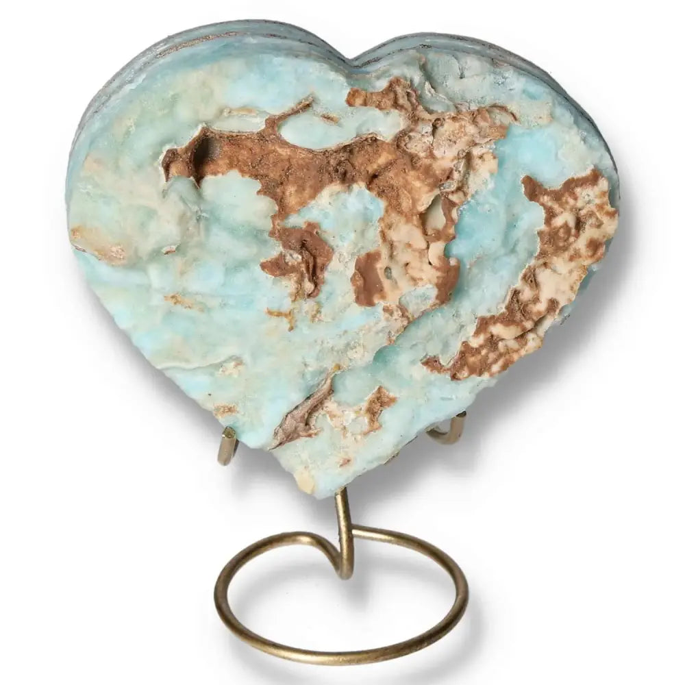 Blue Aragonite Heart gemstone on stand, showcasing ocean-blue tones and natural textures for emotional healing and tranquility.