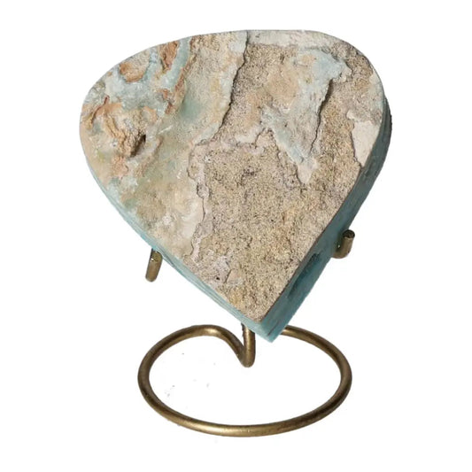 Heart-shaped blue aragonite crystal on stand, showcasing unique textures and ocean-blue hues for emotional healing and tranquility.