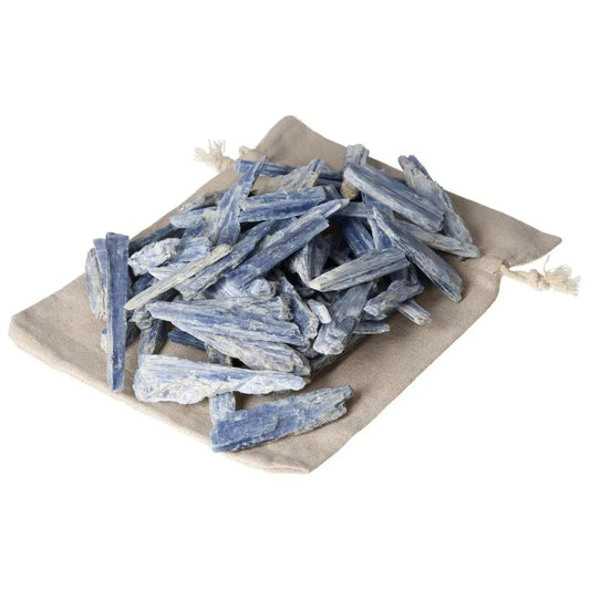 Blue Kyanite sticks on a cloth pouch, known for enhancing concentration and aiding in balanced transformation.