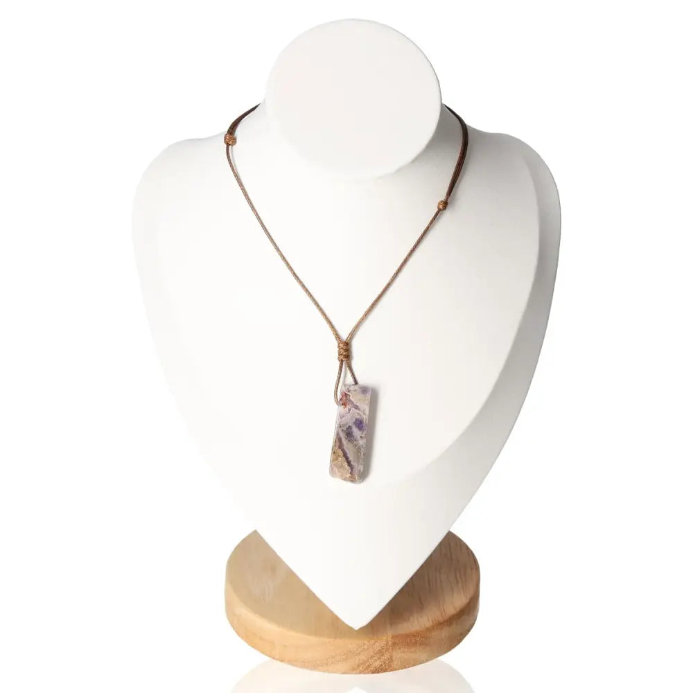 Boho Necklace Amethyst on display stand, featuring a natural stone pendant for a stylish and tranquil look with genuine amethyst energy.