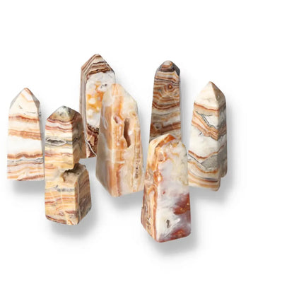 Brown Aragonite Tower collection showcasing natural earthy tones and stabilizing properties, ideal for enhancing spaces with grounding energy.