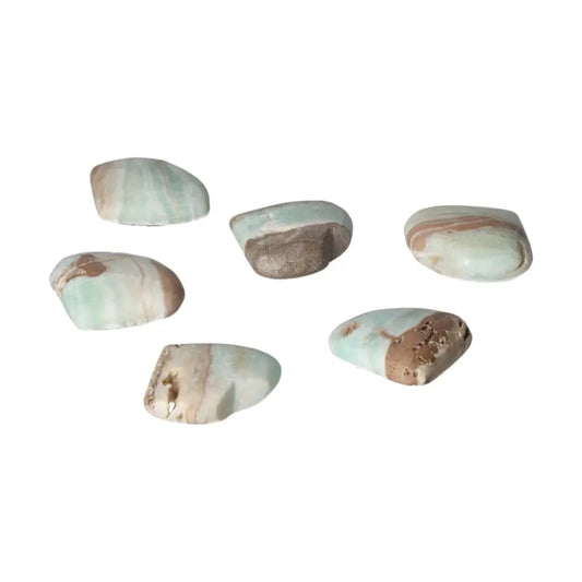 Collection of Caribbean Calcite stones showcasing blue and white hues, representing peace and emotional balance.