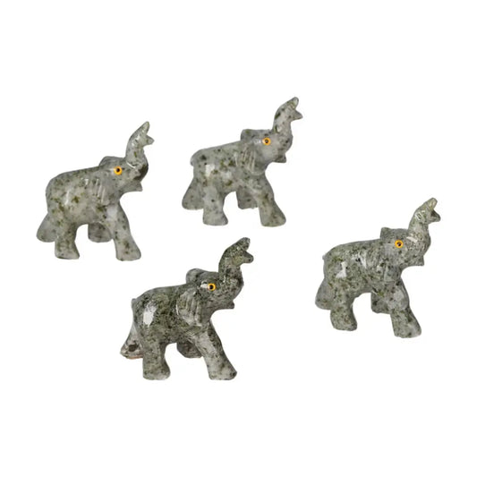 Set of four carved crystal elephant figurines made from high-quality dolomite, showcasing intricate details and calming aesthetic charm.