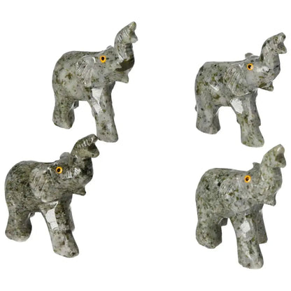 Set of carved crystal elephant figurines showcasing detailed craftsmanship with green and gray dolomite, perfect for decor or meditation.