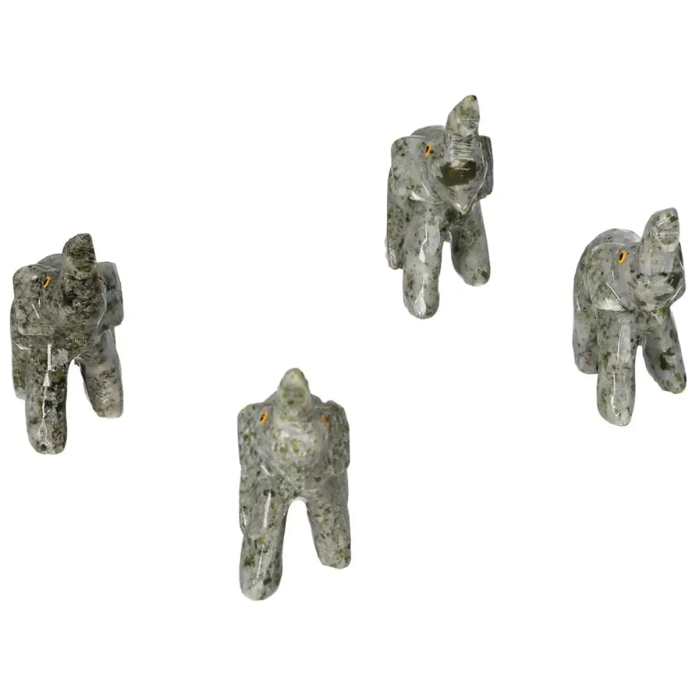 Carved Crystal Elephant statues made from dolomite, showcasing intricate design and calming presence by Sylvia Crystals.