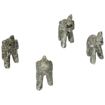Carved Crystal Elephant statues made from dolomite, showcasing intricate design and calming presence by Sylvia Crystals.