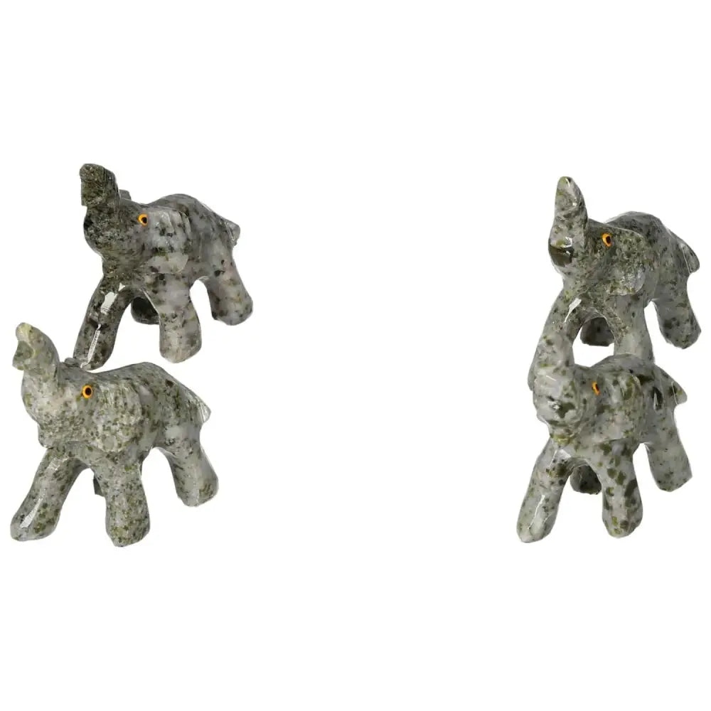 Four intricately carved crystal elephants made from dolomite, showcasing exquisite craftsmanship and calming energy.