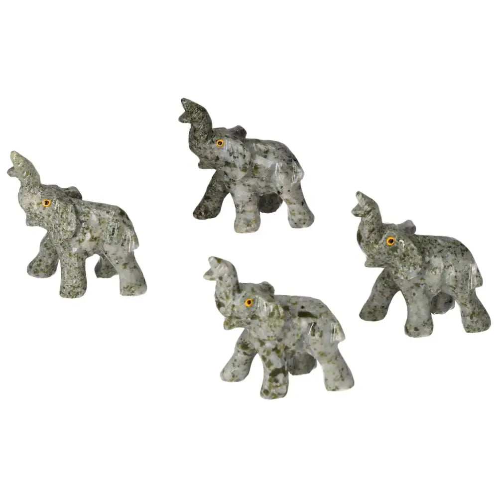 Four carved crystal elephants with intricate designs made from high-quality dolomite, ideal for home decor and emotional grounding.