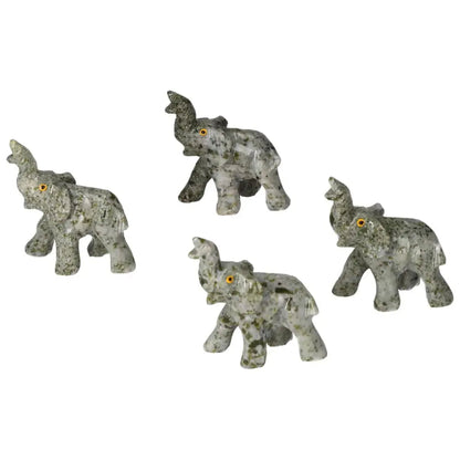 Four carved crystal elephants with intricate designs made from high-quality dolomite, ideal for home decor and emotional grounding.