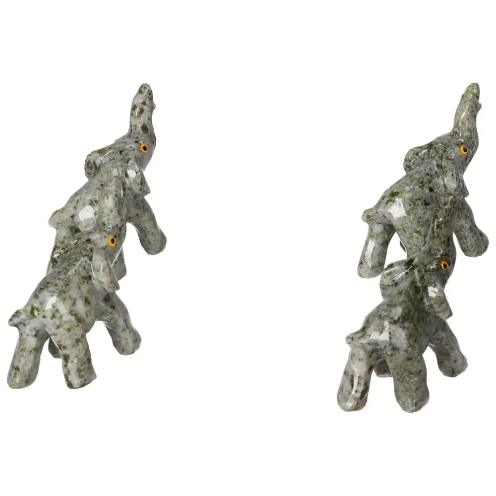 Carved Crystal Elephant figurines in dolomite, showcasing intricate design for tranquility and elegance from Sylvia Crystals.