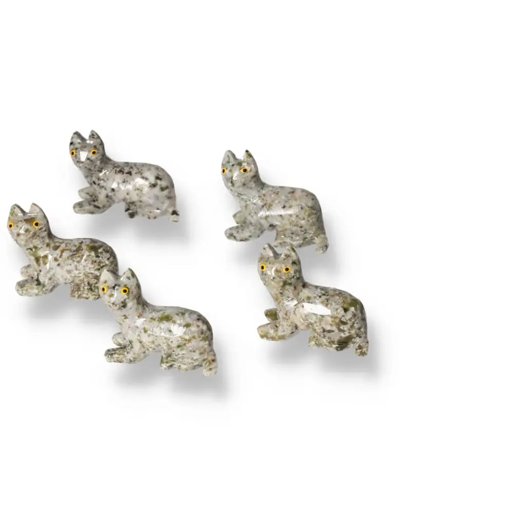 Group of five intricately carved dolomite cat figures with natural stone patterns, designed as decorative centerpieces for tranquility and beauty.