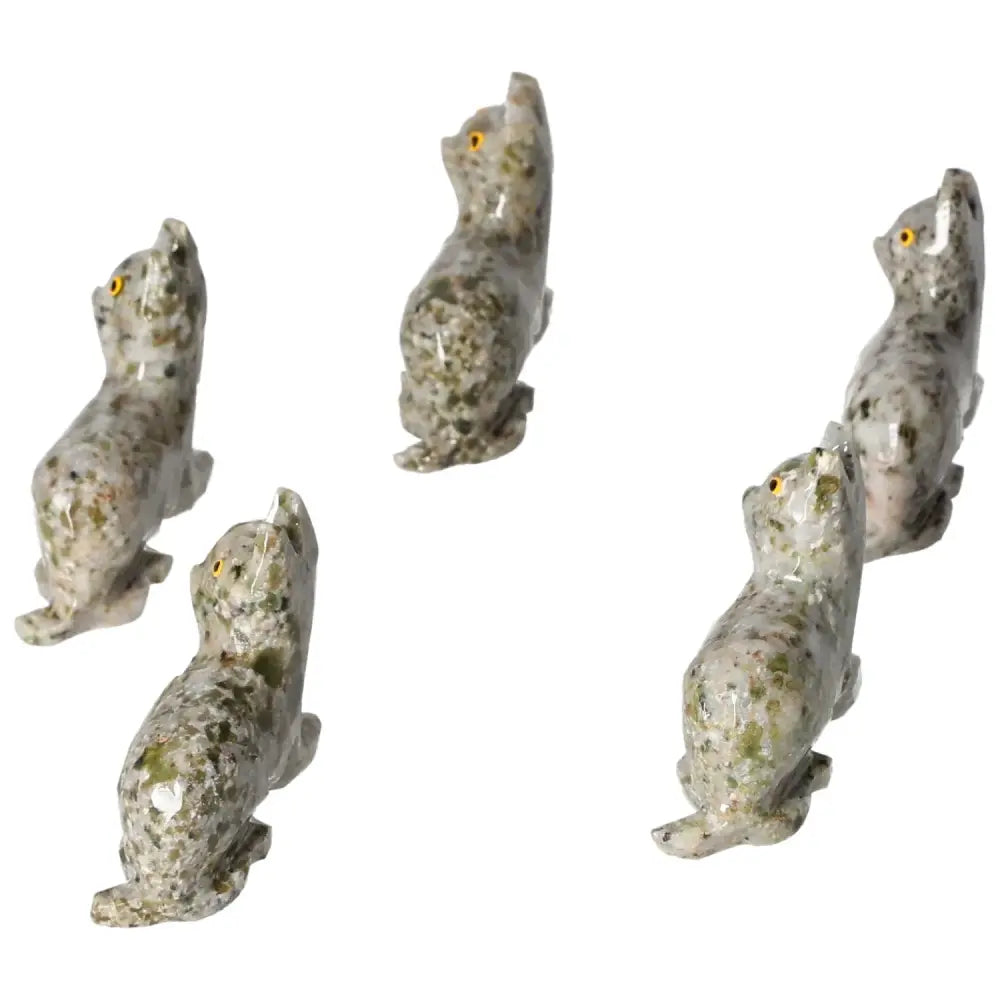 Five Carved Dolomite Cat figures from Sylvia Crystals, showcasing exquisite craftsmanship and calming aesthetics.