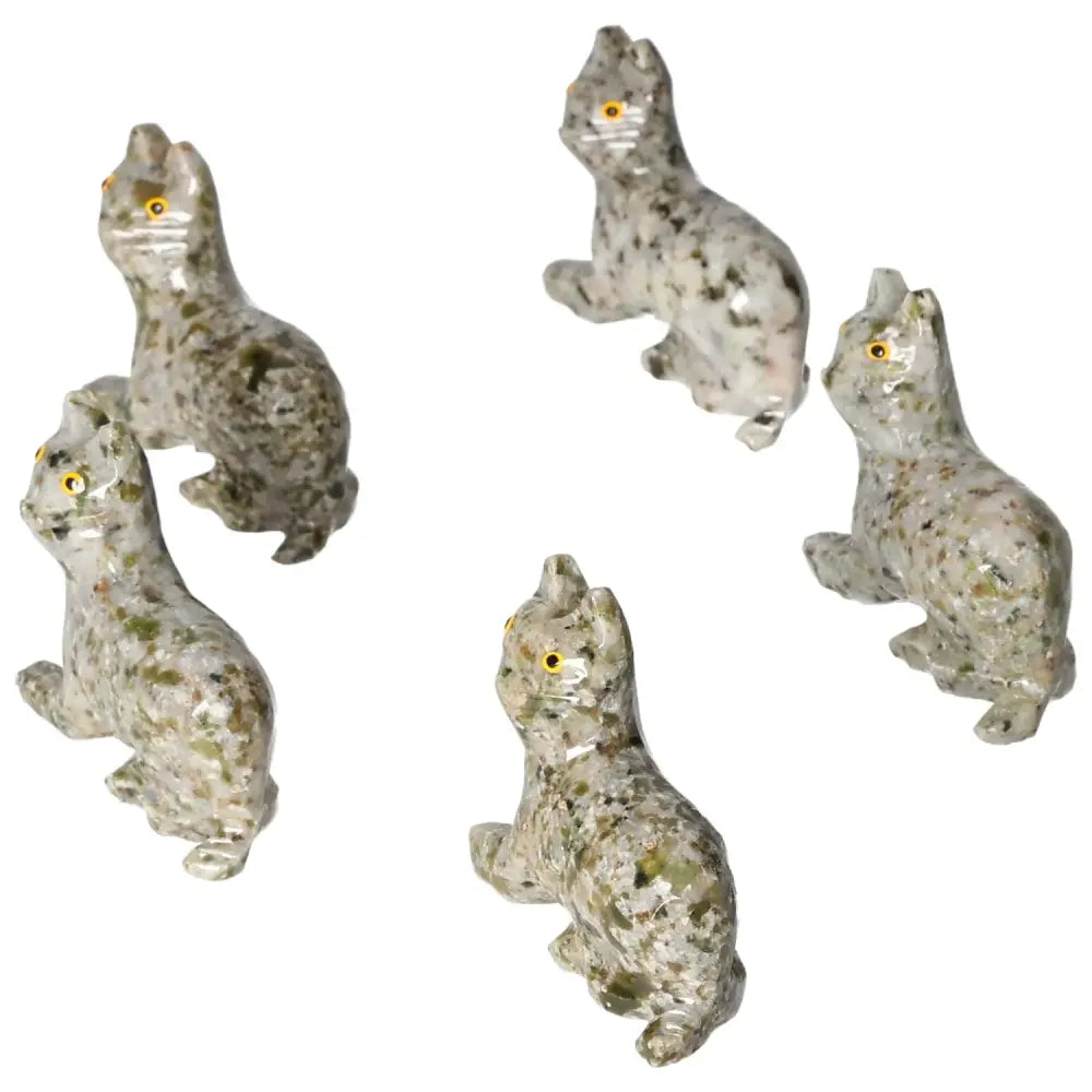 Set of intricately carved dolomite cat figurines known for their calming properties, enhancing home decor with natural stone aesthetics.