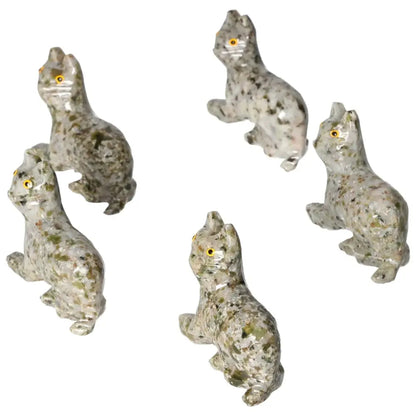 Set of intricately carved dolomite cat figurines known for their calming properties, enhancing home decor with natural stone aesthetics.