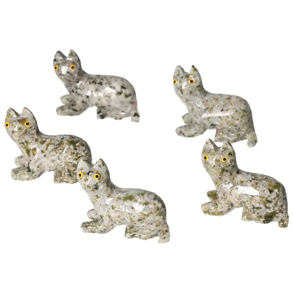 Five intricately carved dolomite cat figurines with a natural stone finish, enhancing décor with calming aesthetics.
