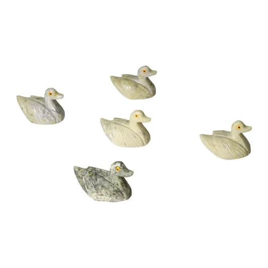 Collection of five carved dolomite duck figures, showcasing serenity and elegance, ideal for home decor and emotional balance.