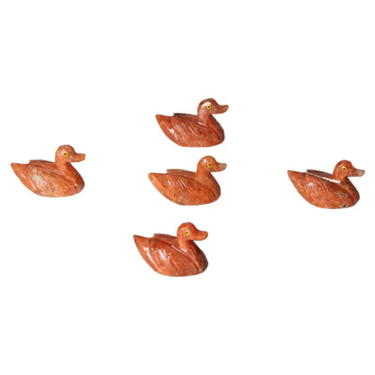 Handcrafted carved dolomite ducks, showcasing Sylvia Crystals' artistry and promoting tranquility and well-being.