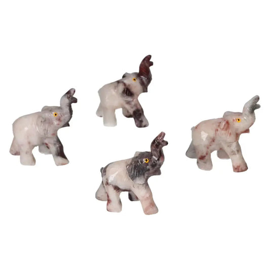 Set of carved dolomite elephant figurines with intricate details, designed for home and office decor by Sylvia Crystals.