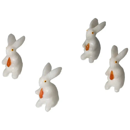 Four carved dolomite rabbit figures from Sylvia Crystals, enhancing spiritual balance and luxury decor.