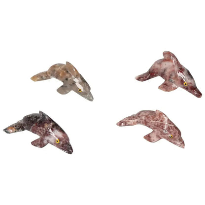 Elegant carved magnesite dolphin figurines from Sylvia Crystals, perfect for enhancing meditation spaces and promoting peace.
