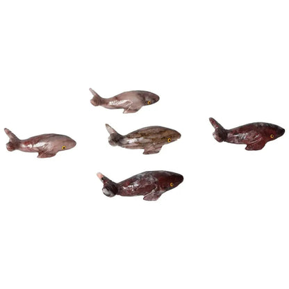 Carved Magnesite Whale figurines, handcrafted and available from Sylvia Crystals, showcasing elegance and spiritual symbolism.