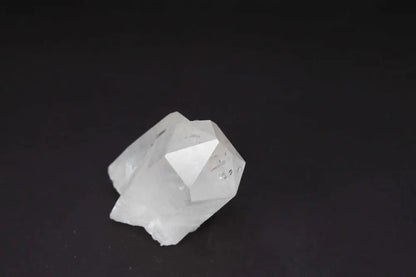 Clear Quartz Cluster - Natural crystal points on dark background, amplifying energy and intention, radiating purity and vibrational harmony.