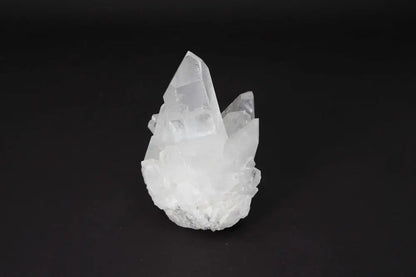 Clear Quartz Cluster featuring multiple crystal points on a shared matrix, known for amplifying energy and bringing harmony.
