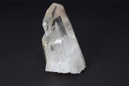 Clear Quartz Cluster displaying crystal points on black background, radiating pure energy and high vibrational clarity.
