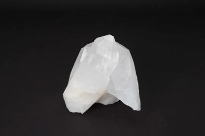 Clear Quartz Cluster emitting pure energy, showcasing its multiple crystal points for amplifying intention and purifying spaces.