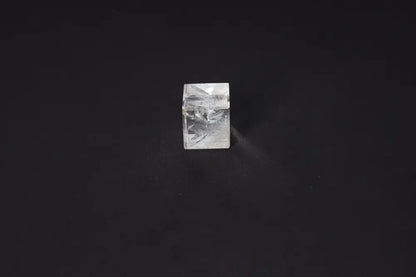 Clear Quartz Cube 3 cm on black background, a stone for purification and harmonizing energy, ideal for negative vibration neutralization.