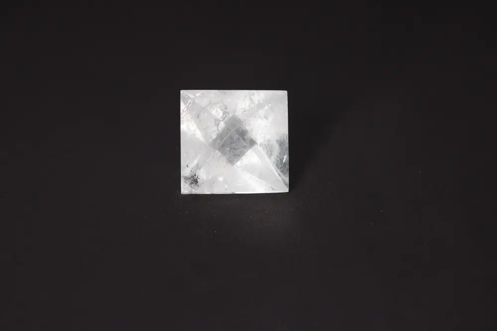 Clear Quartz Double Pyramid 4 cm for harmony and purification, absorbs negative energy and cleanses spaces, against dark background