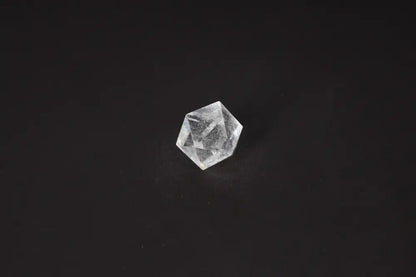 Clear Quartz Geometric Sphere 3 cm on black background, perfect for purification and harmonizing spaces, absorbing negative energy.
