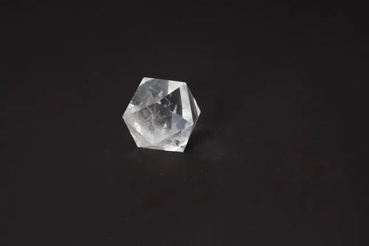 Clear Quartz Geometric Sphere 5 cm on black background for energy purification and harmonization.